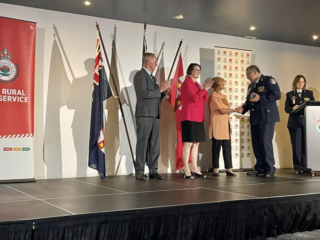 Diane Williams receives her National 45 Year Medal from Peter McKechnie